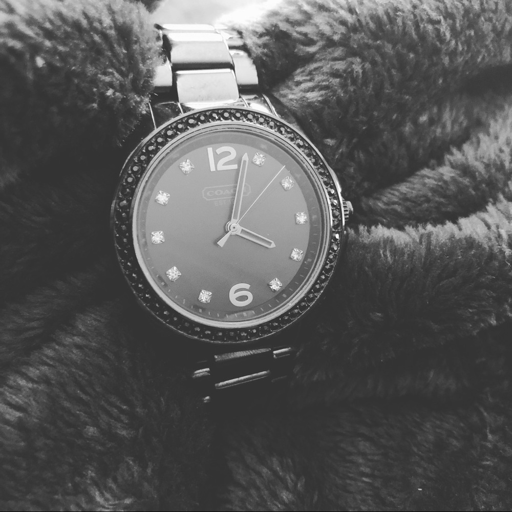 Metallic black COACH watch